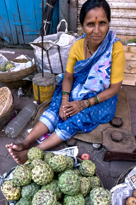 Woman selling custard apples