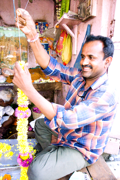 Man Making Wreaths (India)