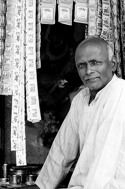 Man And Dangling Small Bags (India)
