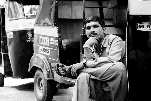 Driver Of Autorickshaw Sat Cross-legged (India)