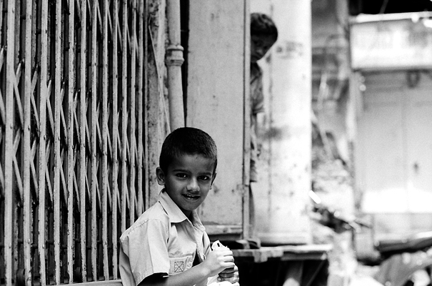 Boy Sitting By The Wayside (India)