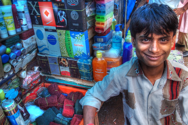 Young Man At A Street Stall (India)
