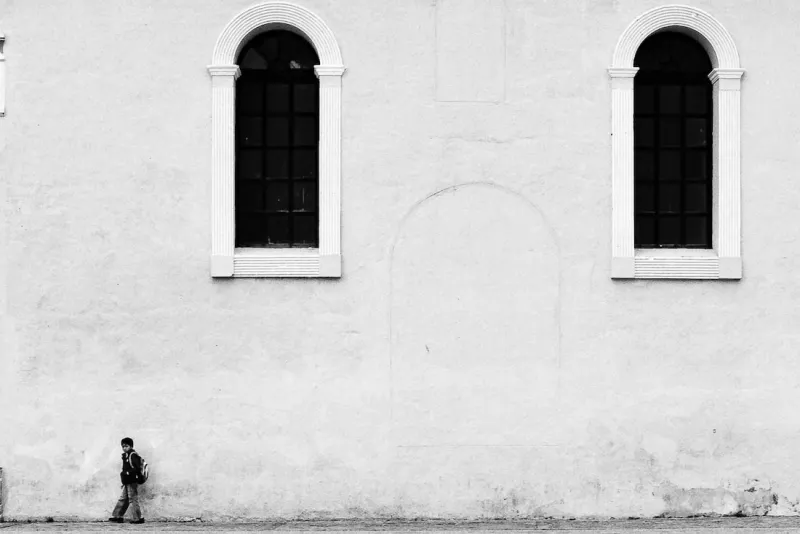 Boy standing against wall