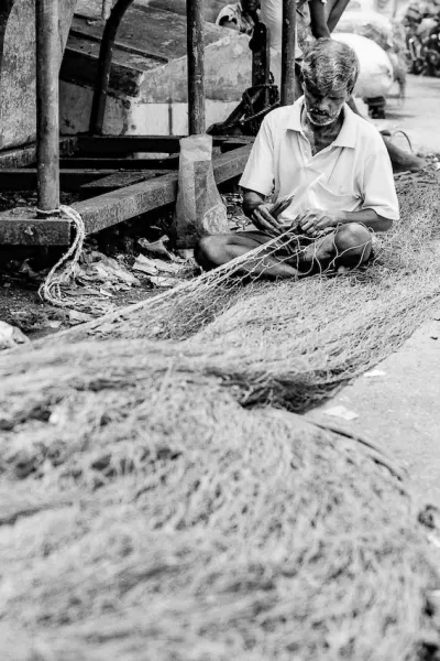 Man repairing fishing net