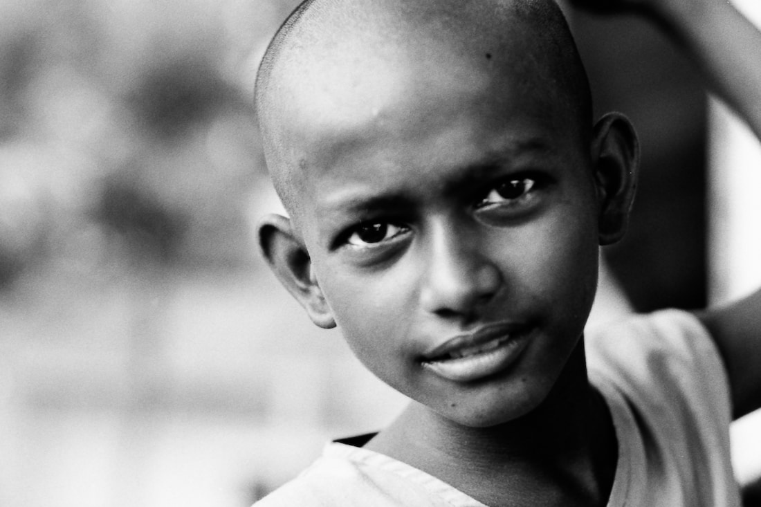 Boy with clean-shaven head
