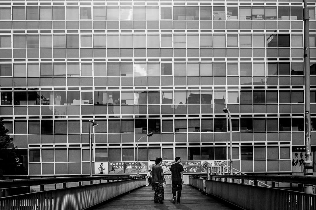 Two men on pedestrian bridge