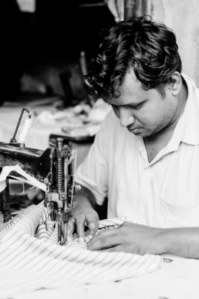 Man sewing with sewing machine