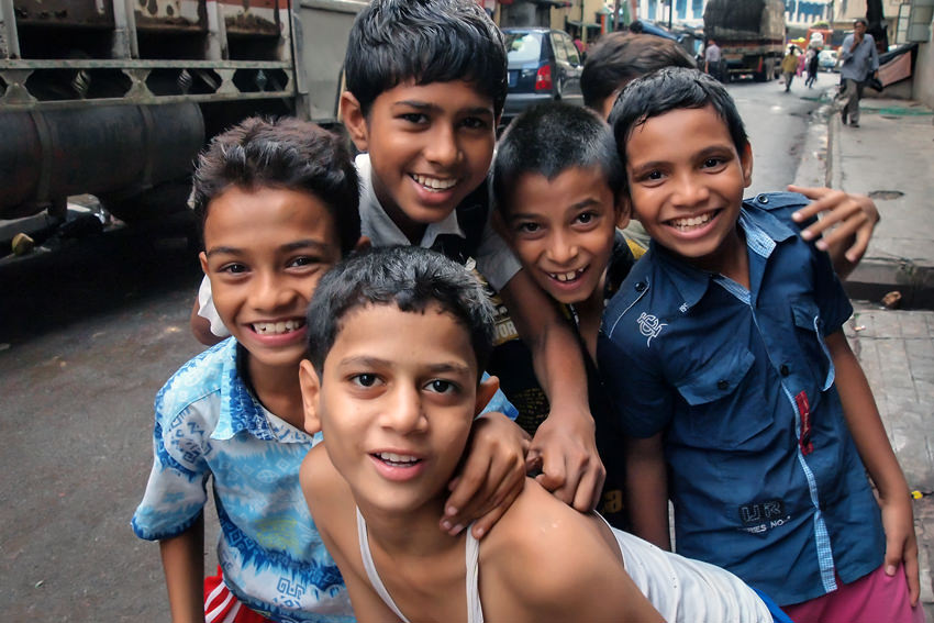 Boys laughing in street