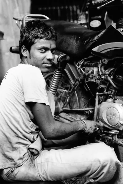 Man repairing a motorbike