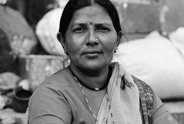 Woman Piercing Her Nose In The Market (India)