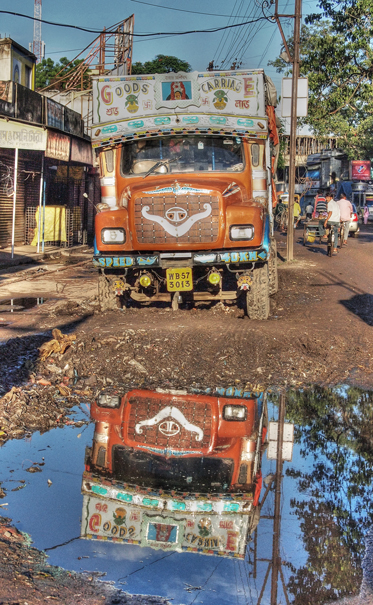 Reflection Of A Truck In A Puddle (India)