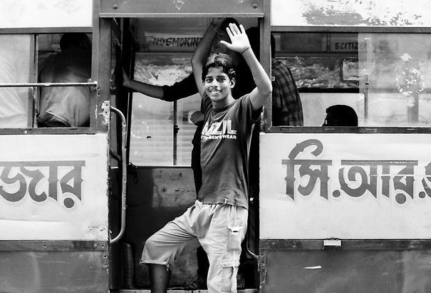 Young man jumping in bus
