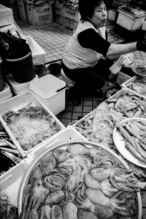 Woman selling octopus