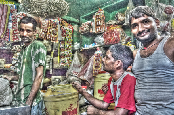 Three Men Piddling Around In A Shop (India)