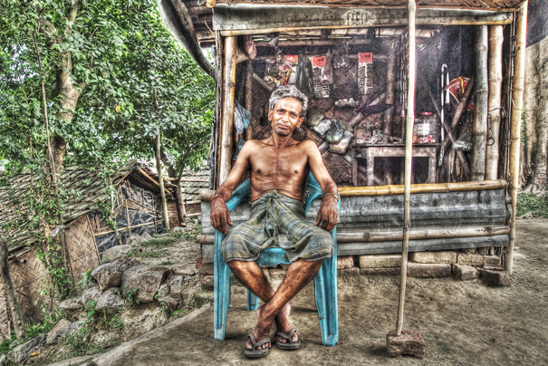 Man In Front Of A Shed (India)