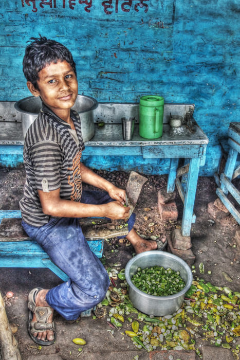 boy cutting vegetables