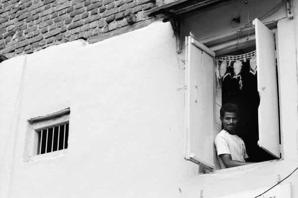 Smiling Man By The Upstairs Window (India)