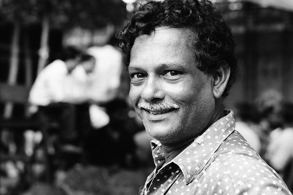 Man Smiles In The Fruit Market (India)