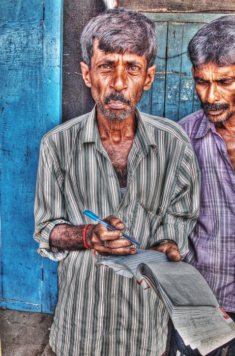 Man having note and pen
