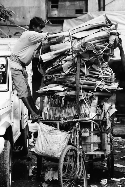 Overloaded Tricycle With Cardboards (India)