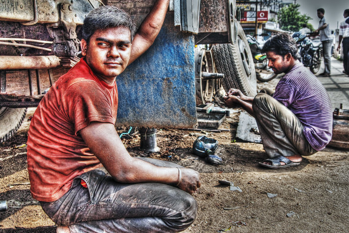 Men repairing truck