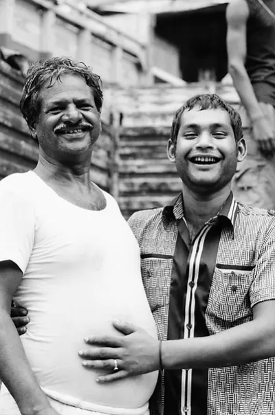 Two men laughing happily