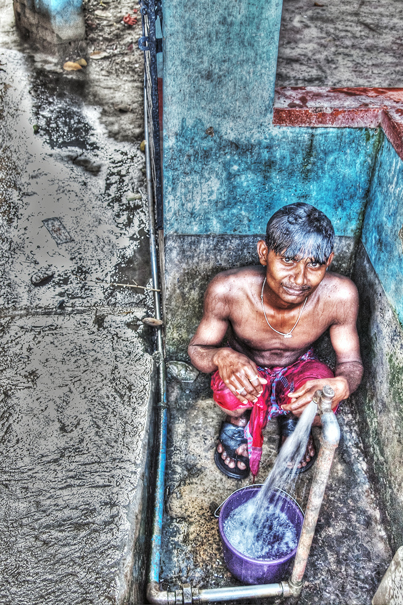 Man Beside A Bibcock (India)