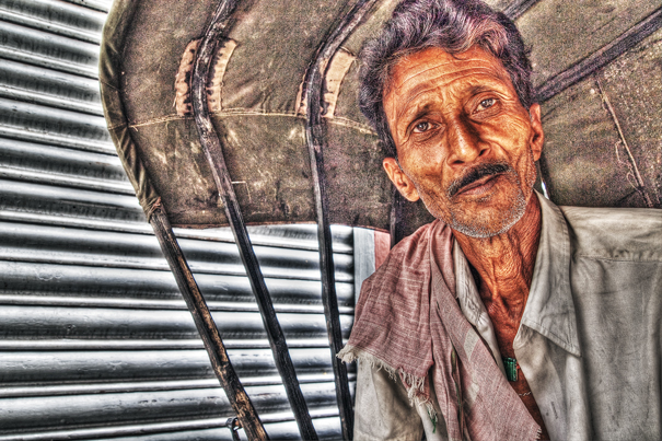 Rickshaw Wallah With A Mustache Sitting On The Seat (India)