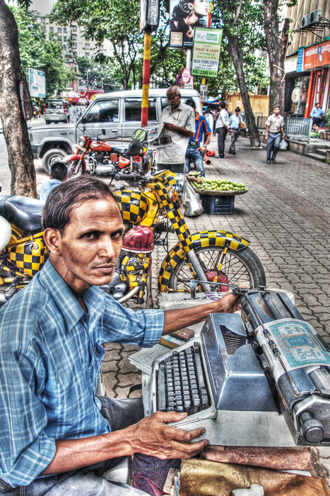 Man working with typewriter