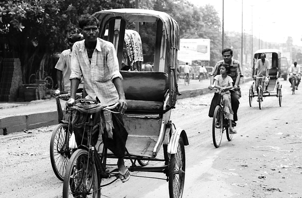 Cycle Rickshaws And Bicycles On The Street (India)