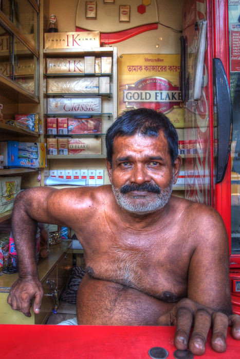 Shirtless tobacconist