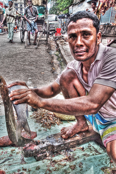 Man cutting fish