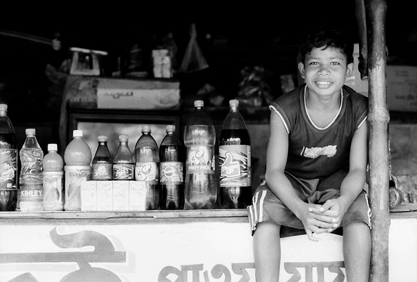 Boy And Plastic Bottles (India)