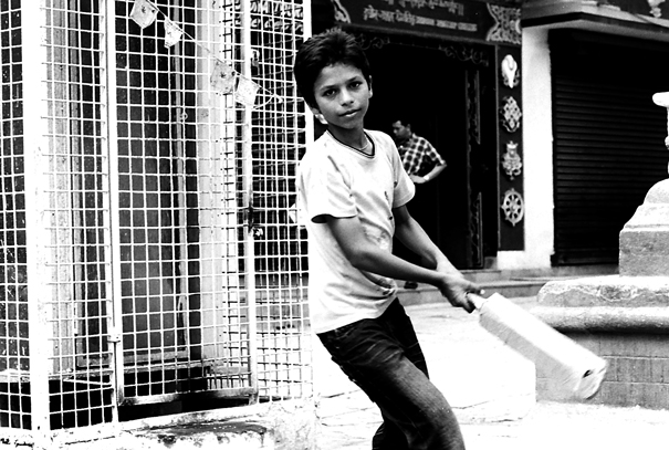 Boy Swinging A Bat (Nepal)