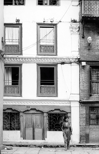 Woman Wearing A Saree Stoof In Front Of A Building (Nepal)