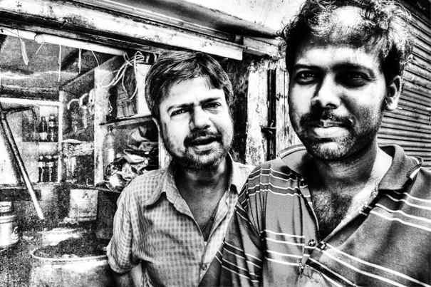 Two Men In The Storefront (India)