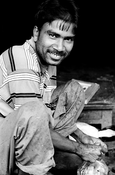 Grinning Man And A Plastic Bag (India)