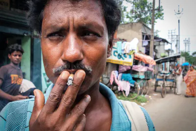 Man smoking short cigarette