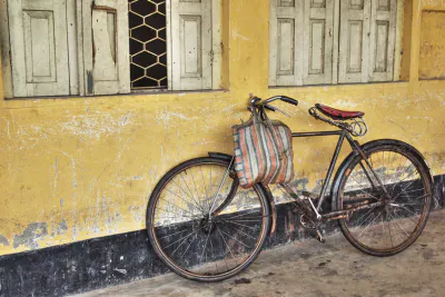 Bicycle leaned against wall