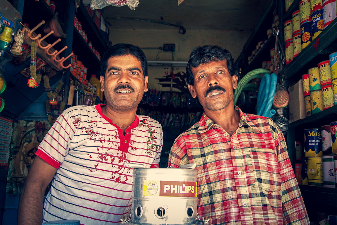 Two men in small shop