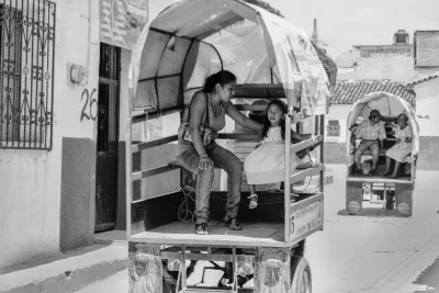 Parent and  child on Motocarro