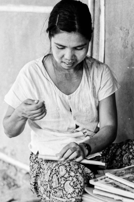 Woman repairing book