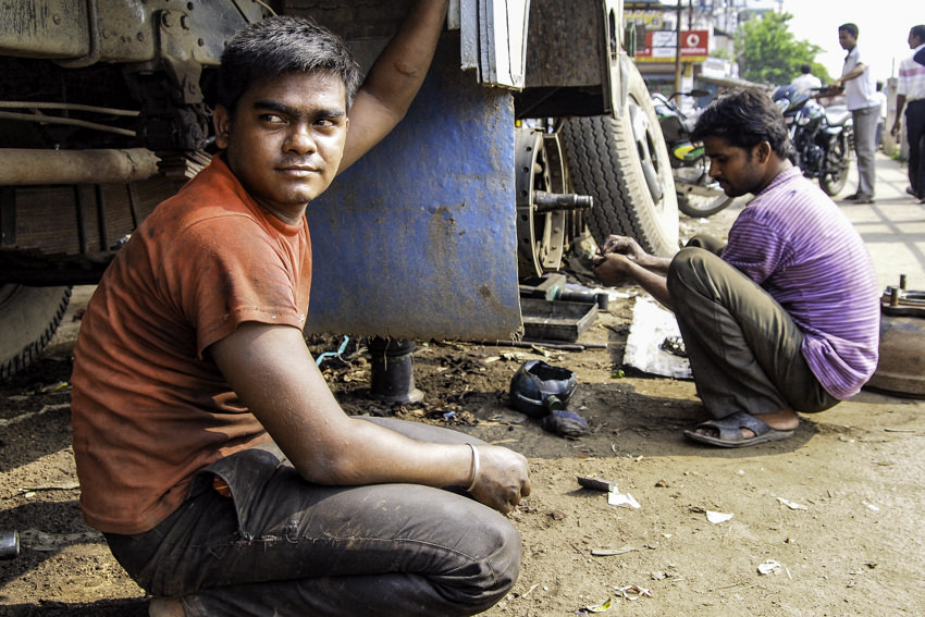 Men repairing truck