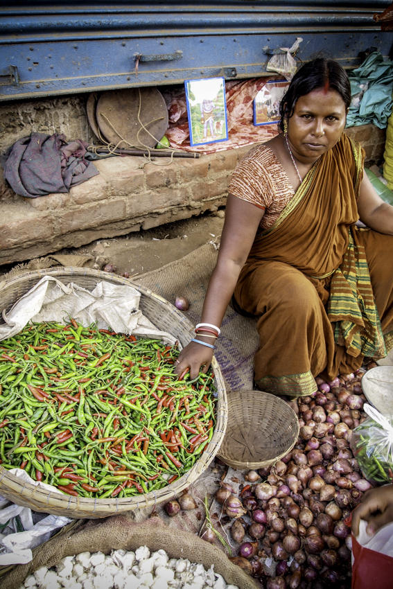 Woman selling chili peppers