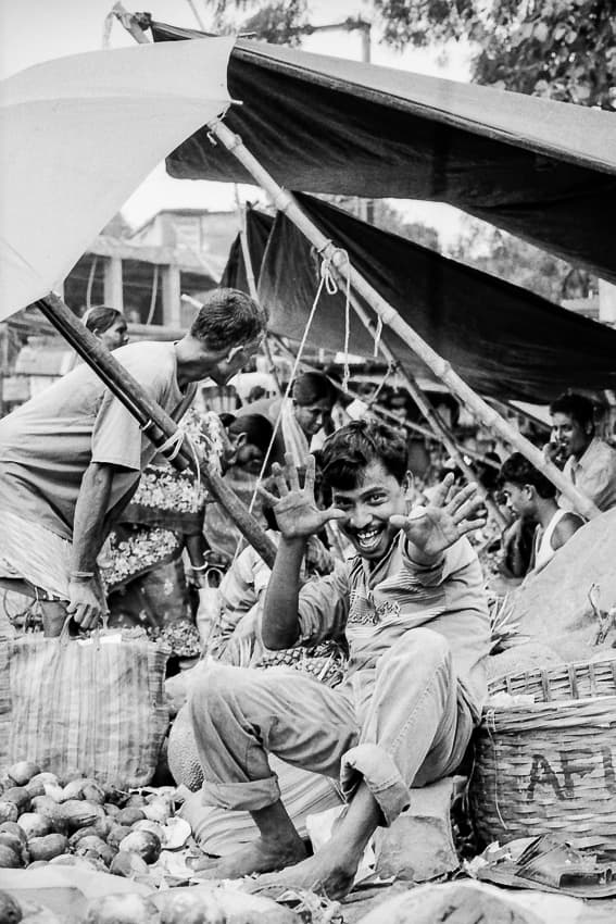 playful street vendor posing