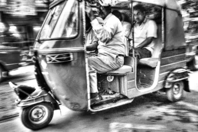 Speeding auto rickshaw