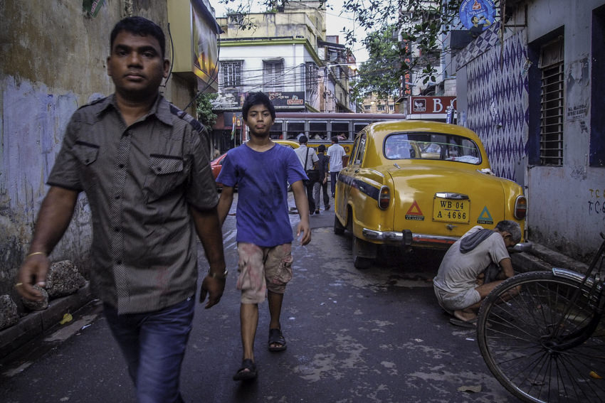 Men walking lane in Kolkata