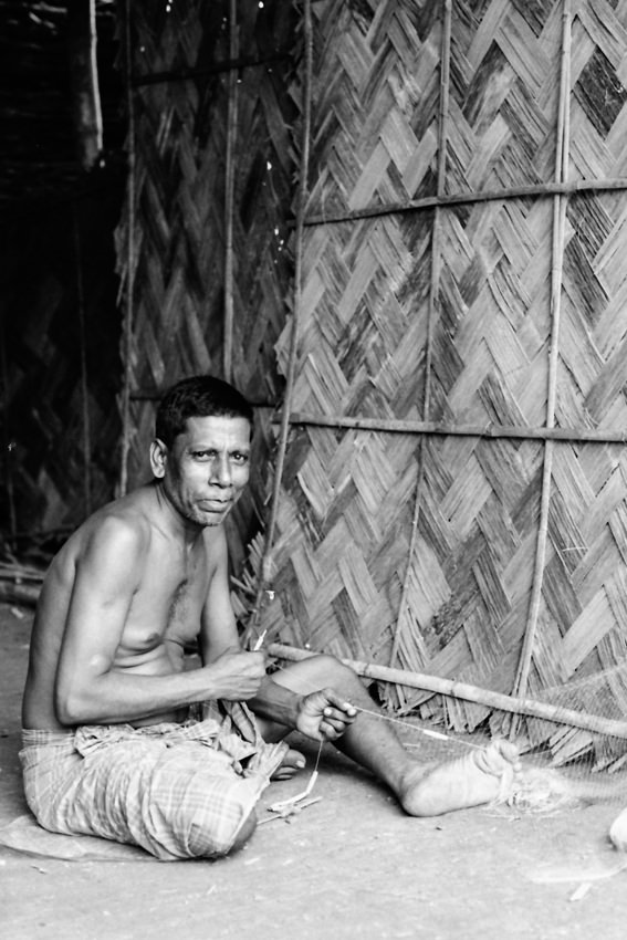 Man repairing fishnet