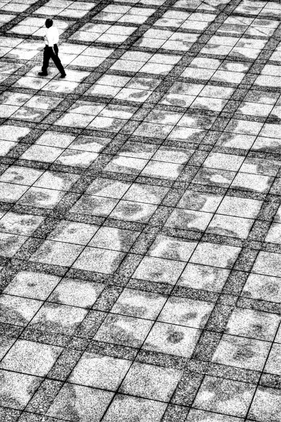 Man walking through pattern