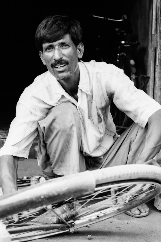 Man repairing wheel